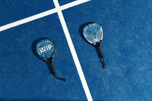 TIE BREAK magnesium, placeholder photo of two padel rackets on court