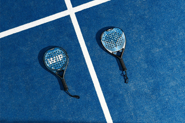TIE BREAK magnesium, placeholder photo of two padel rackets on court